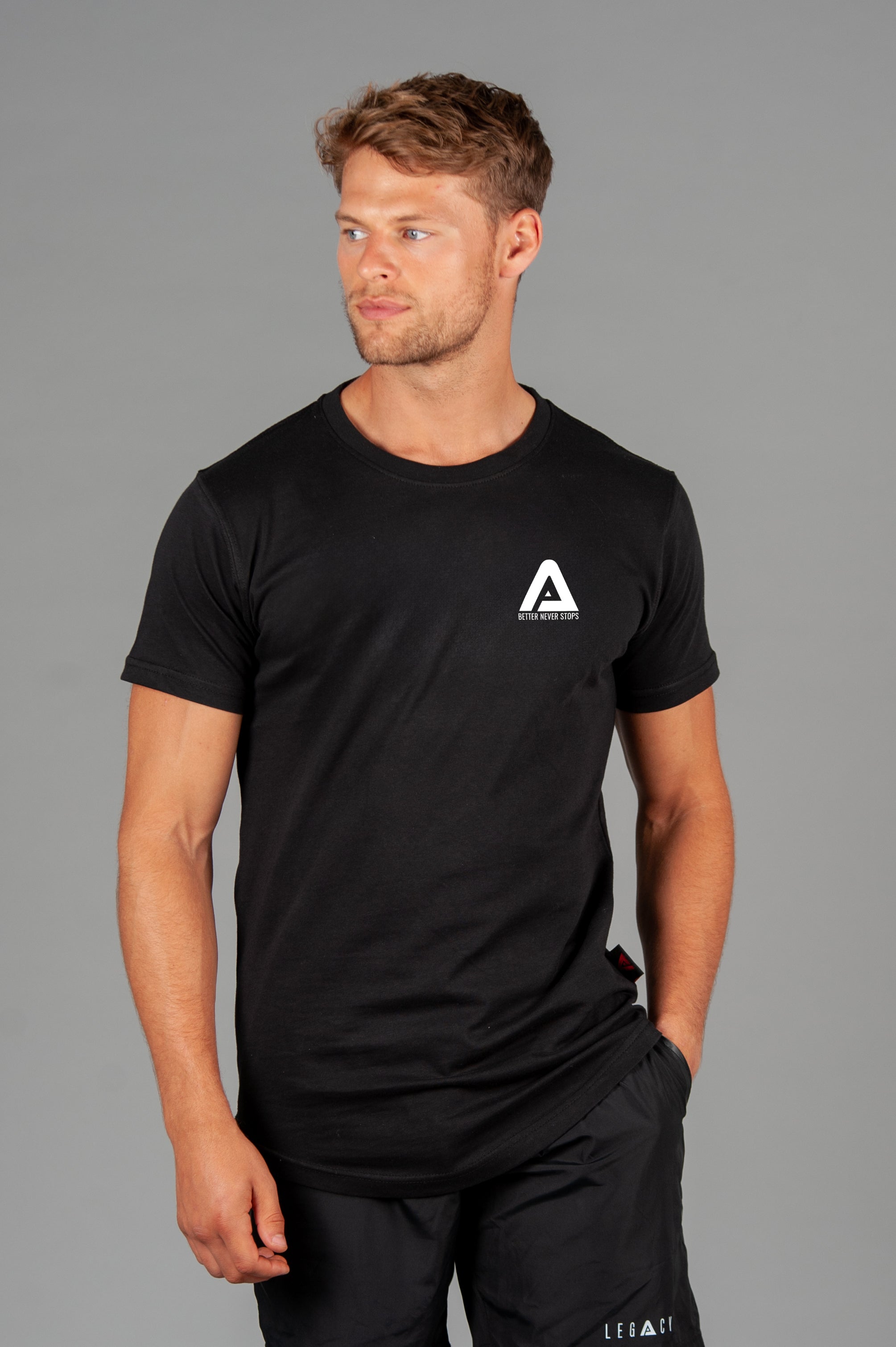 Men's black t-shirt with small white Better Never Stops logo.