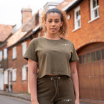 Women's olive crop t-shirt with small white logo.