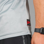 Close up of men's silver moisture wicking t-shirt fabric.