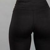 Back view of women's black bike shorts.