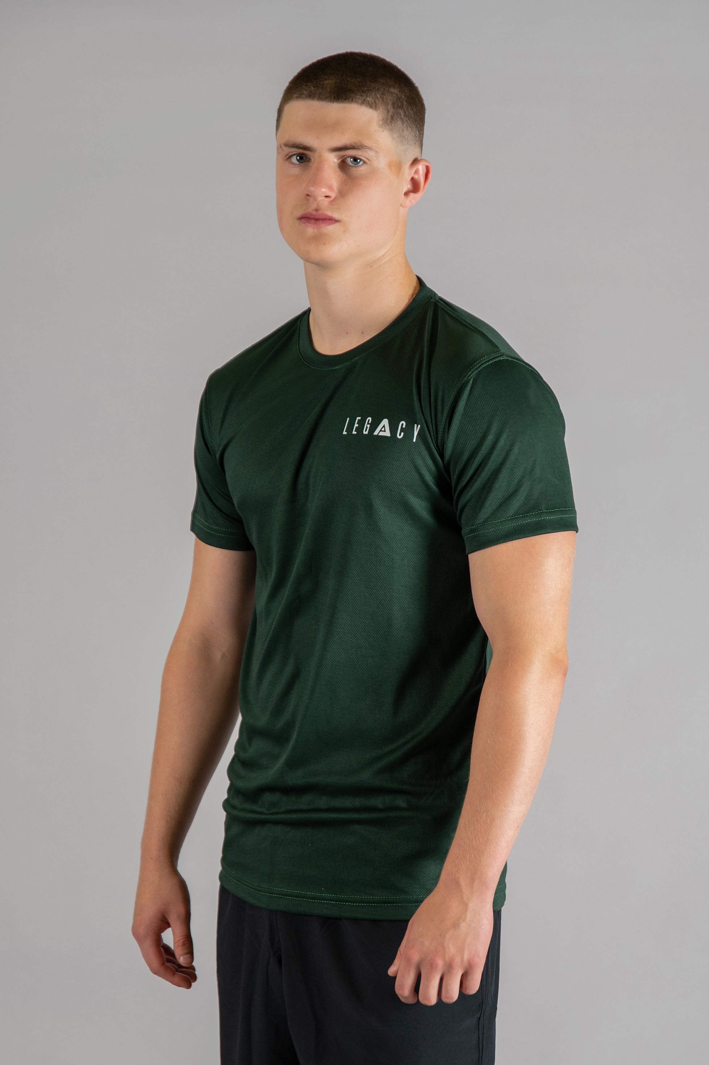 Men's forest green moisture wicking crewneck t-shirt with white logo.