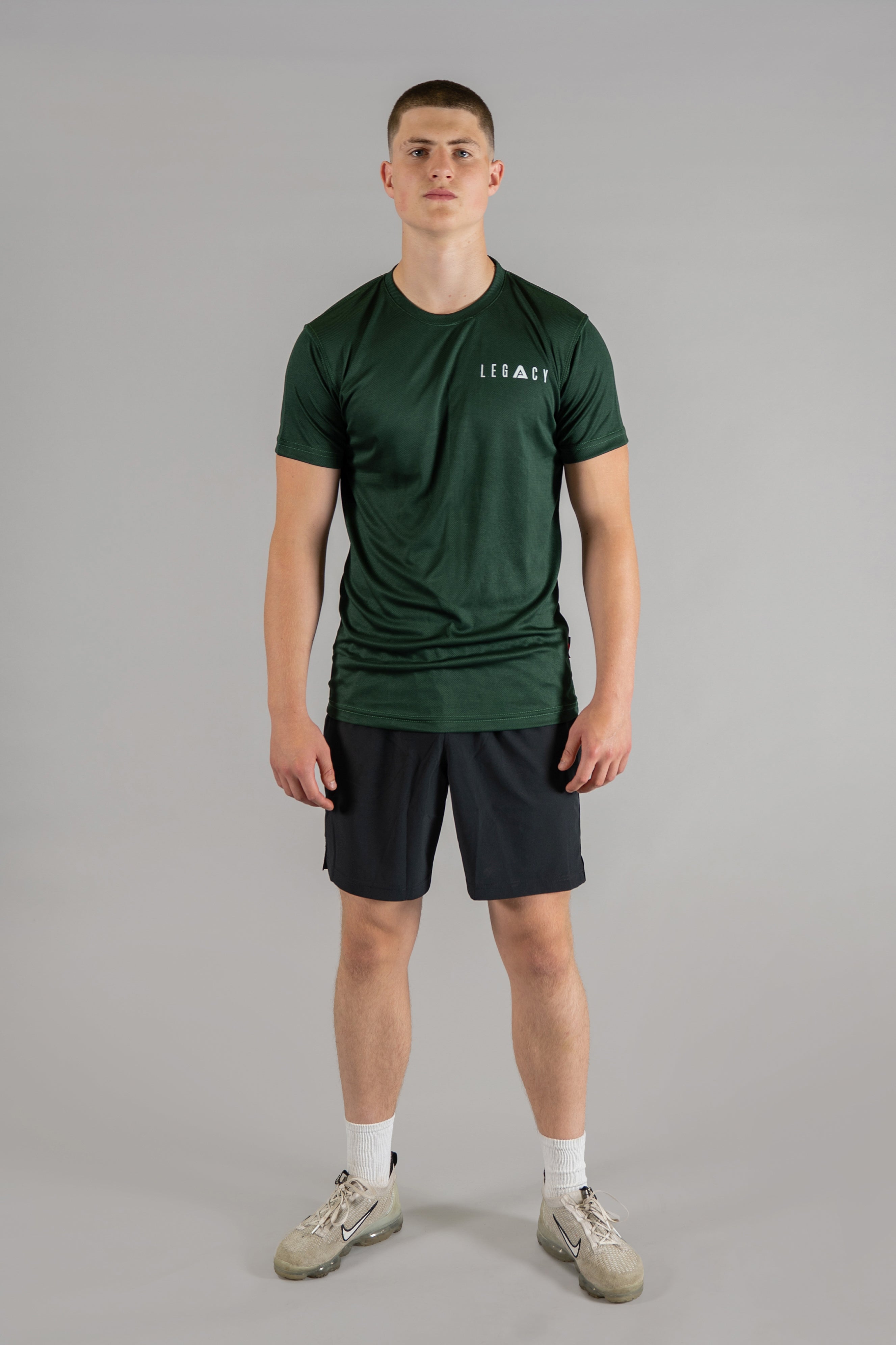 Men's forest green moisture wicking crewneck t-shirt with white logo.