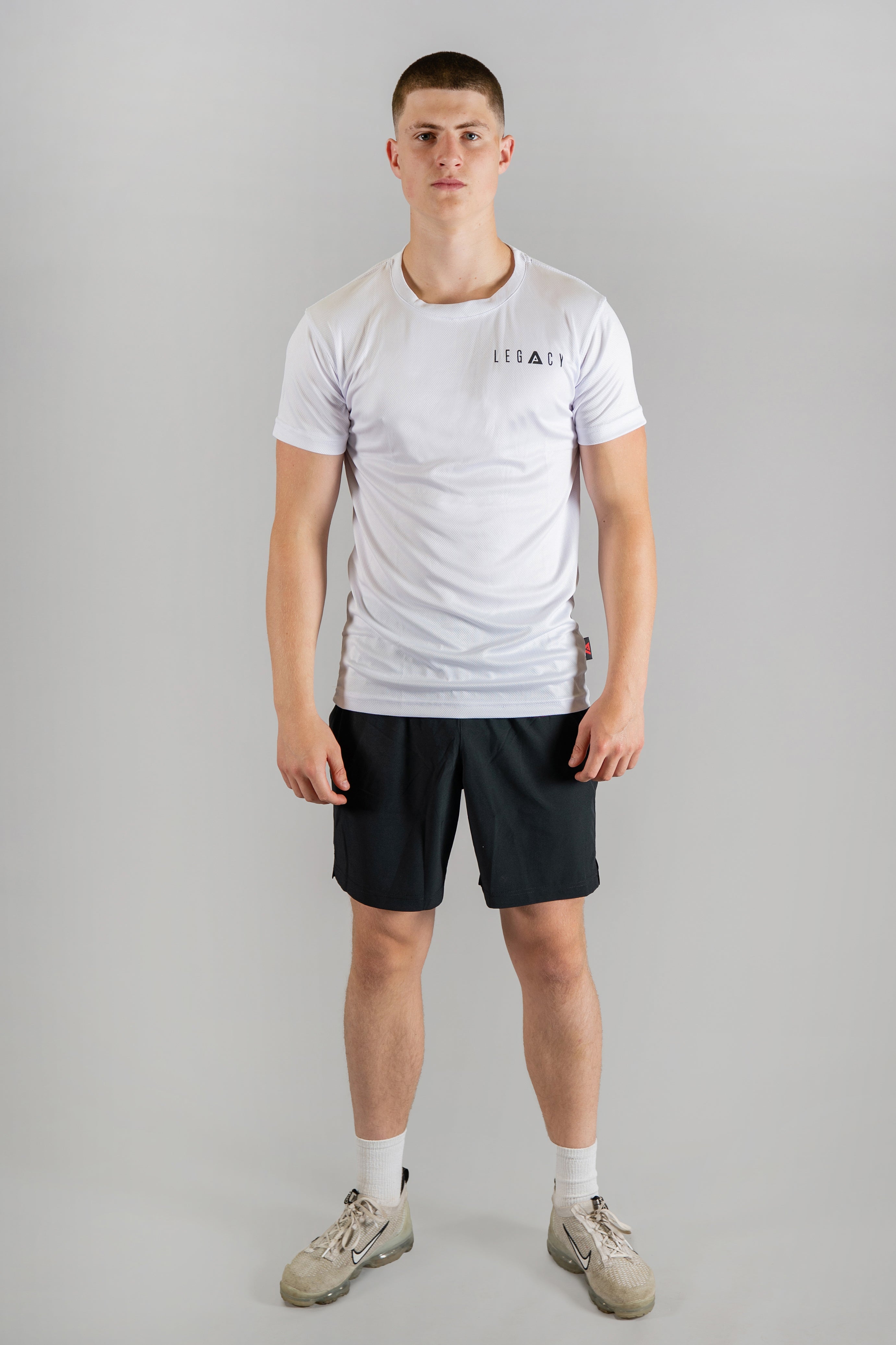 Men's white moisture wicking crewneck t-shirt with black logo.