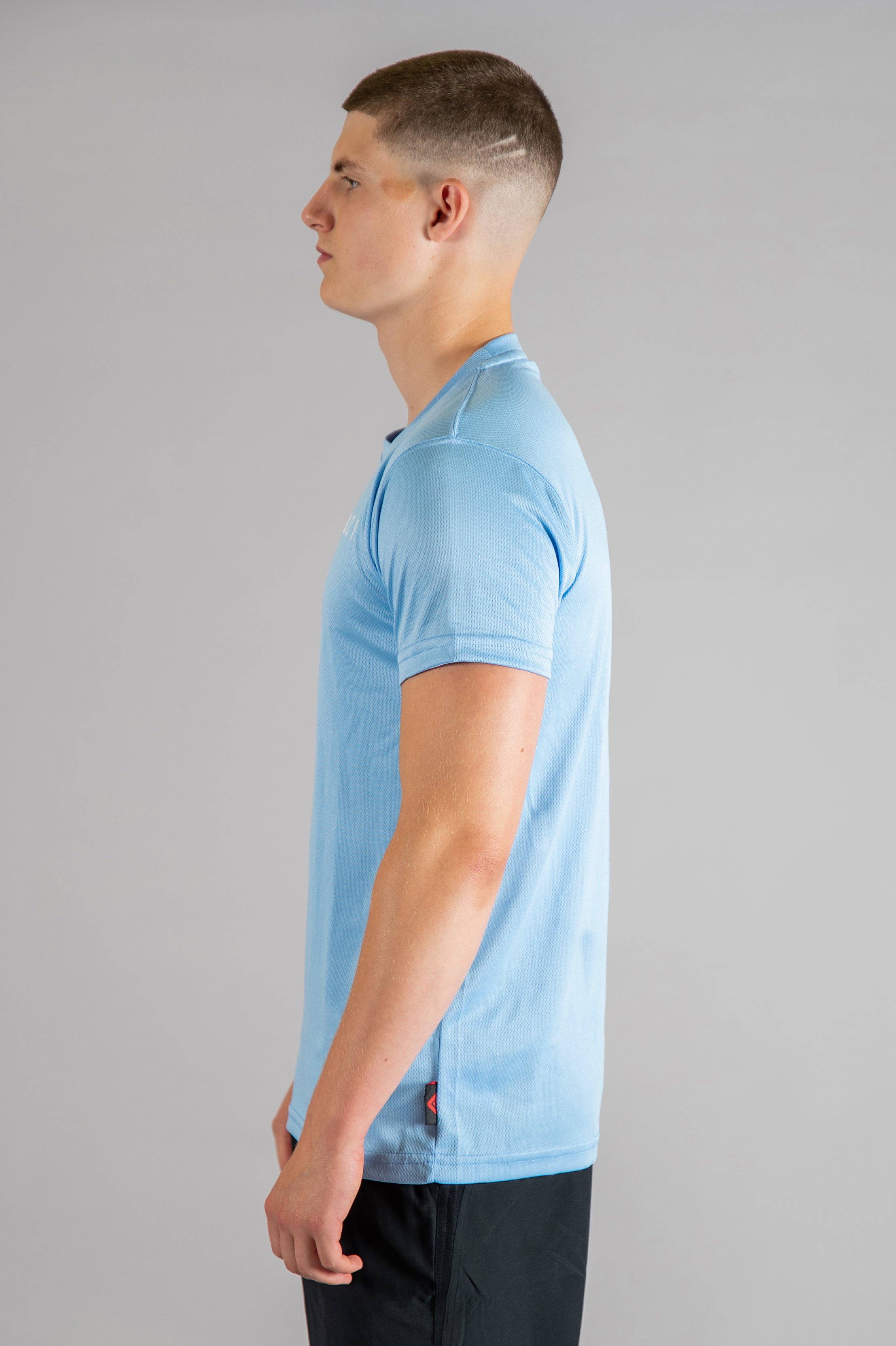 Men's sky blue moisture wicking crewneck t-shirt with white logo.