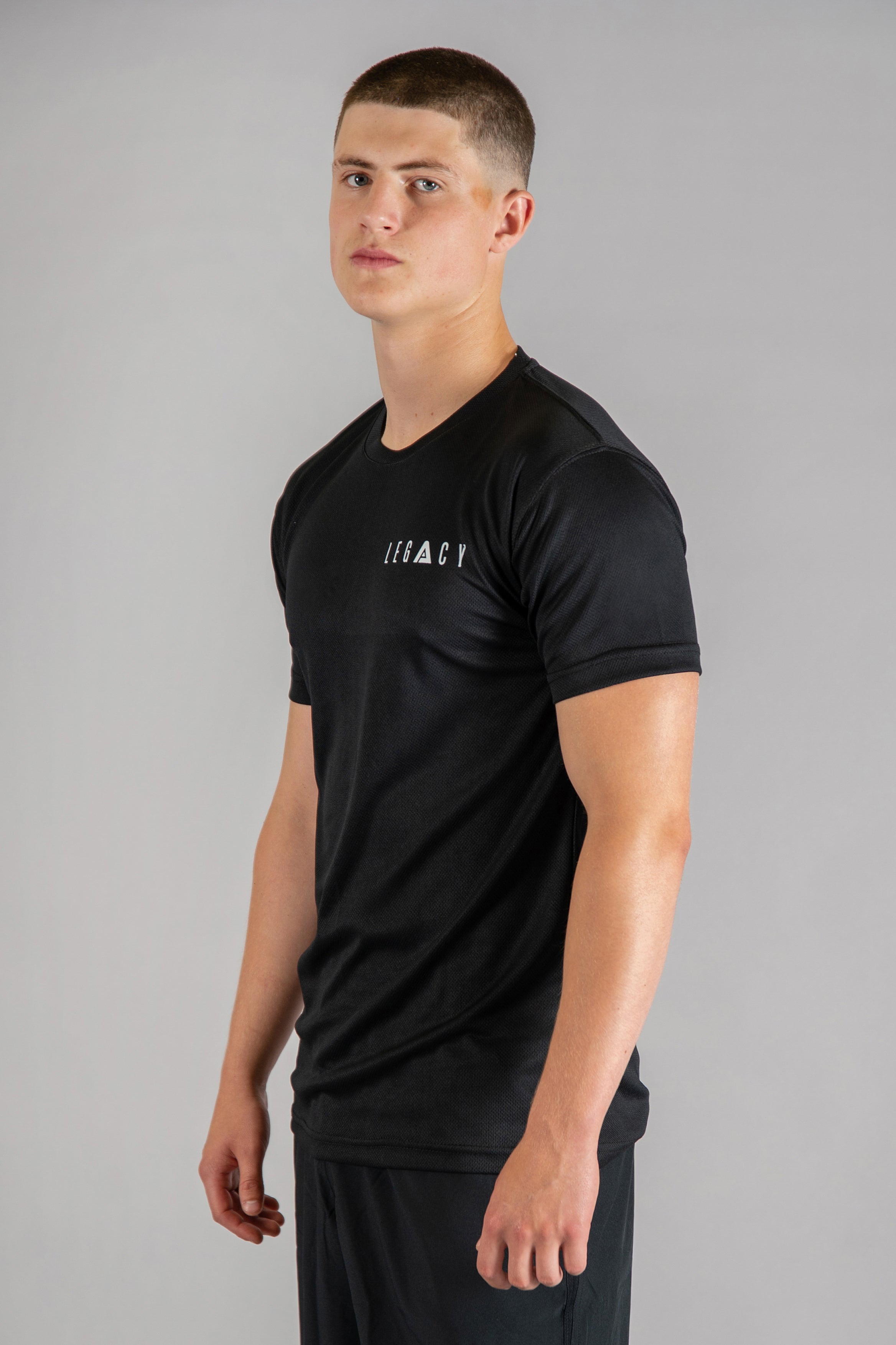 Men's black moisture wicking crewneck t-shirt with white logo.