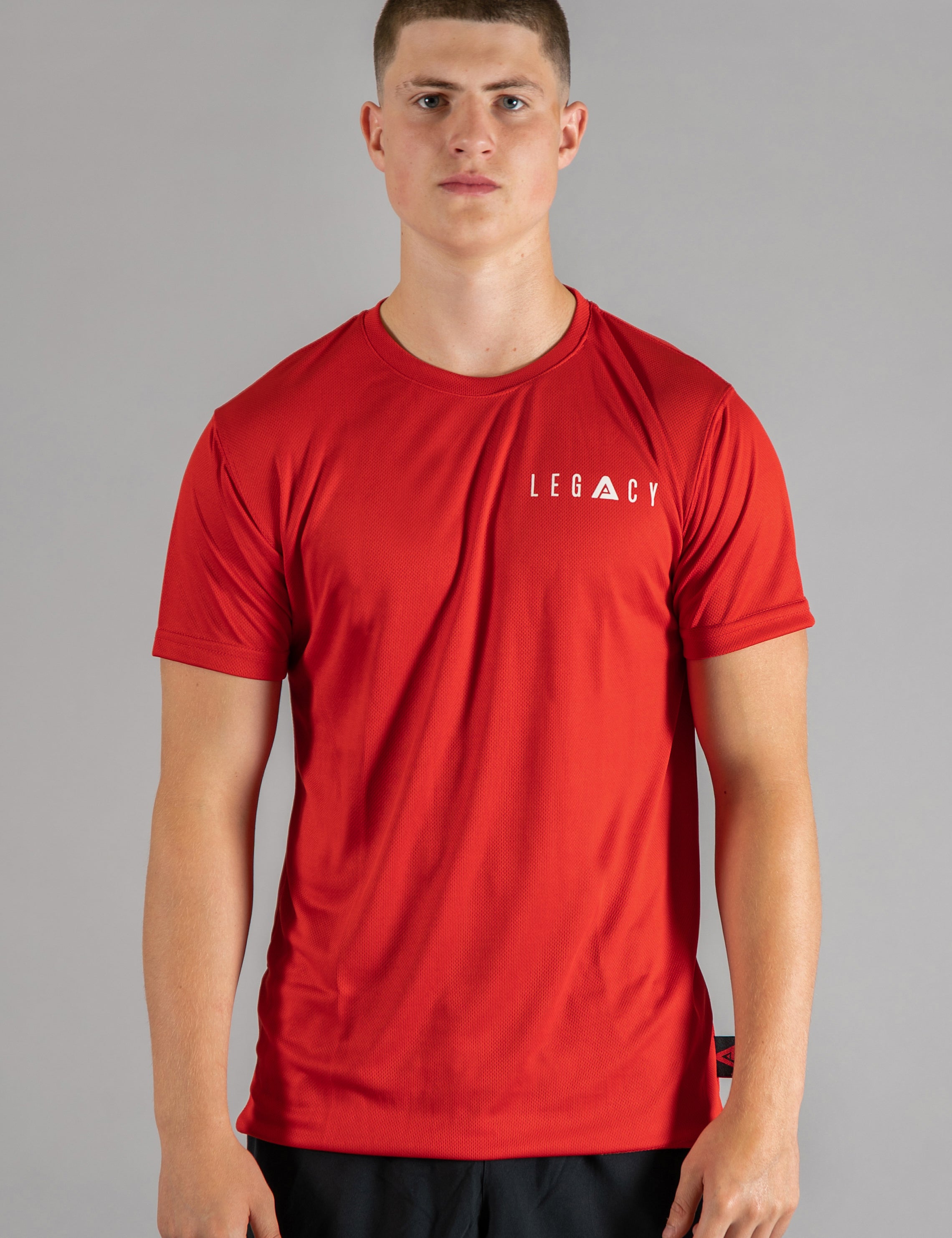 Men's red moisture wicking crewneck t-shirt with white logo.