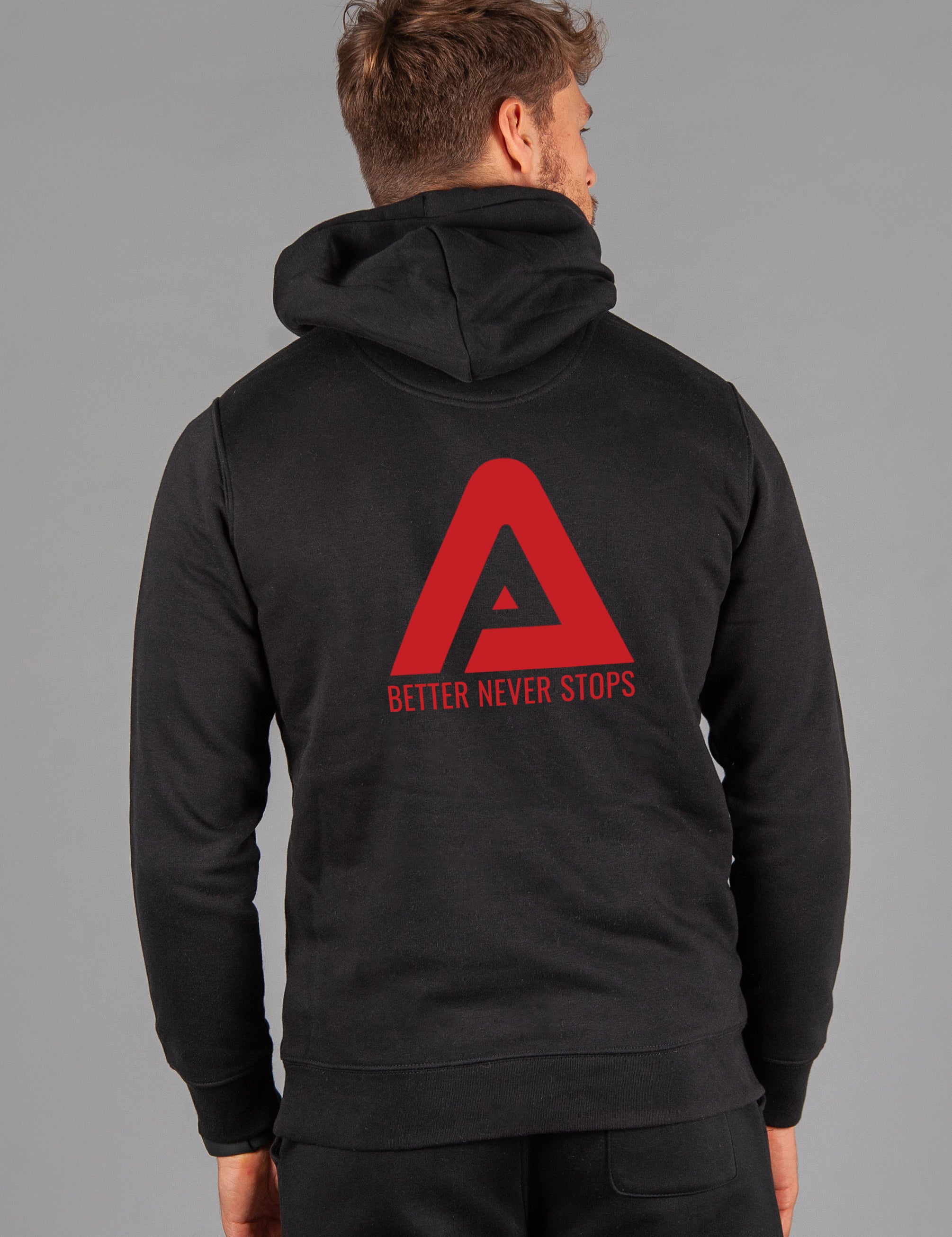 Back view of men's black hoodie with red Better Never Stops logo.