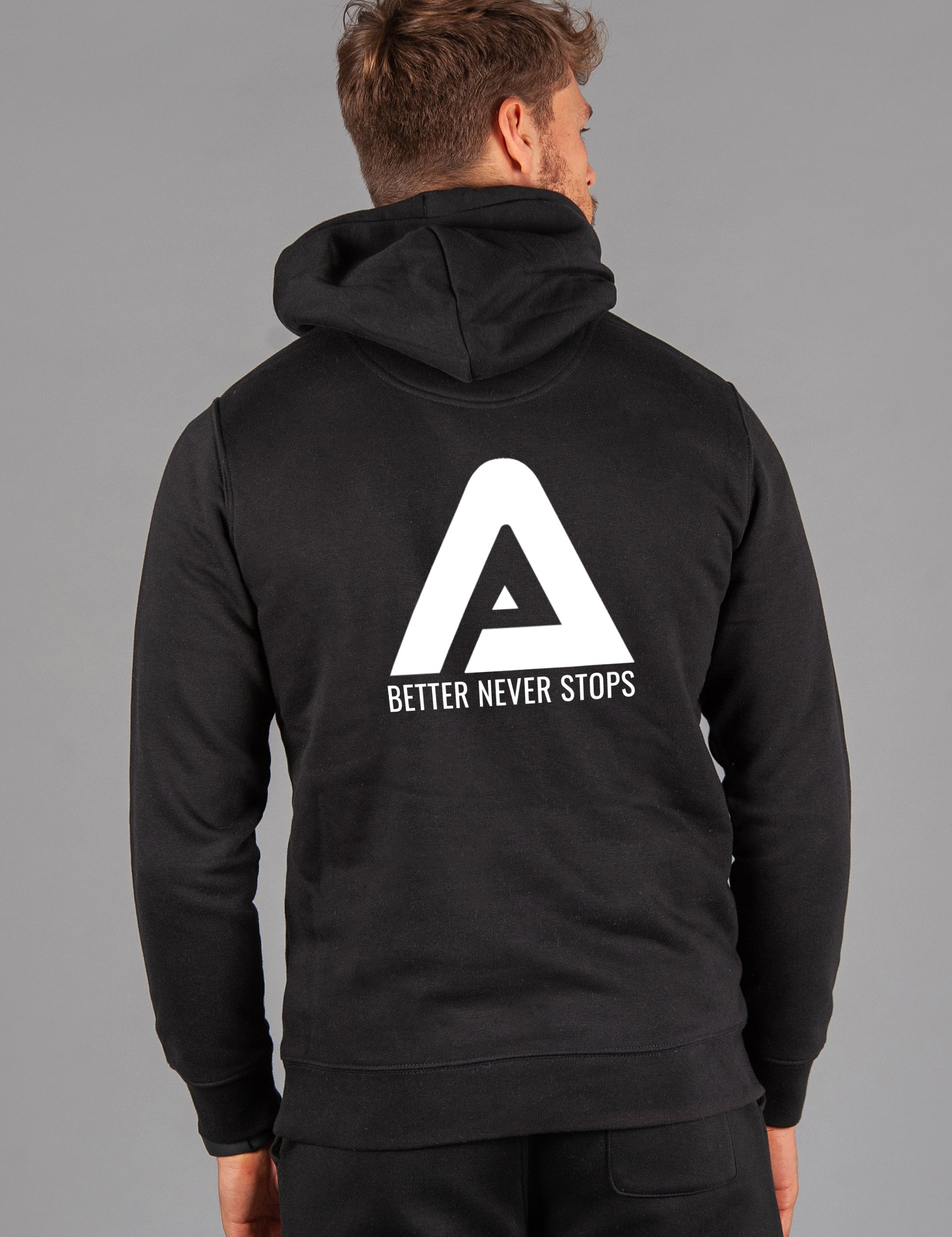 Back view of men's black hoodie with white Better Never Stops logo.