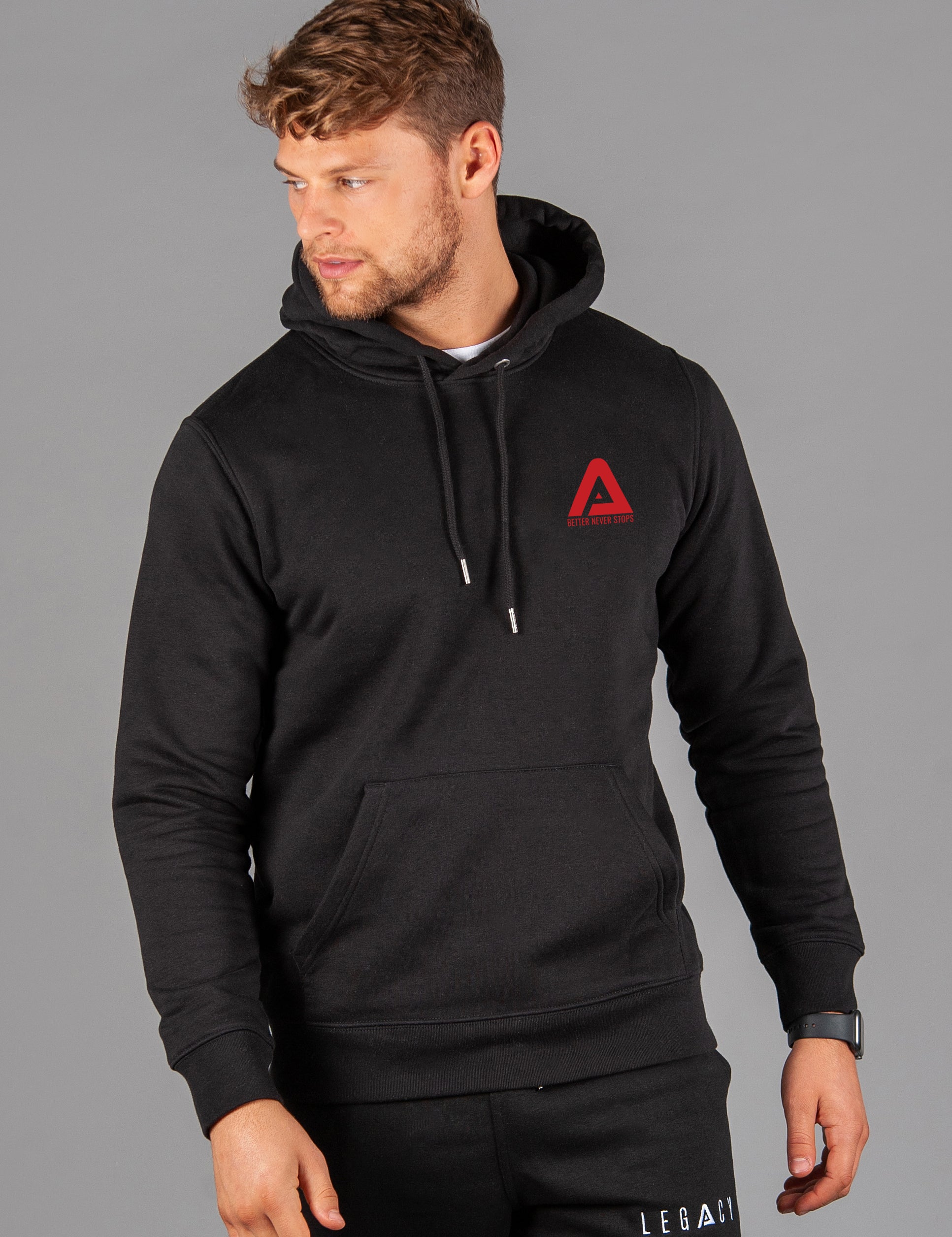 Men's black hoodie with small red Better Never Stops logo.