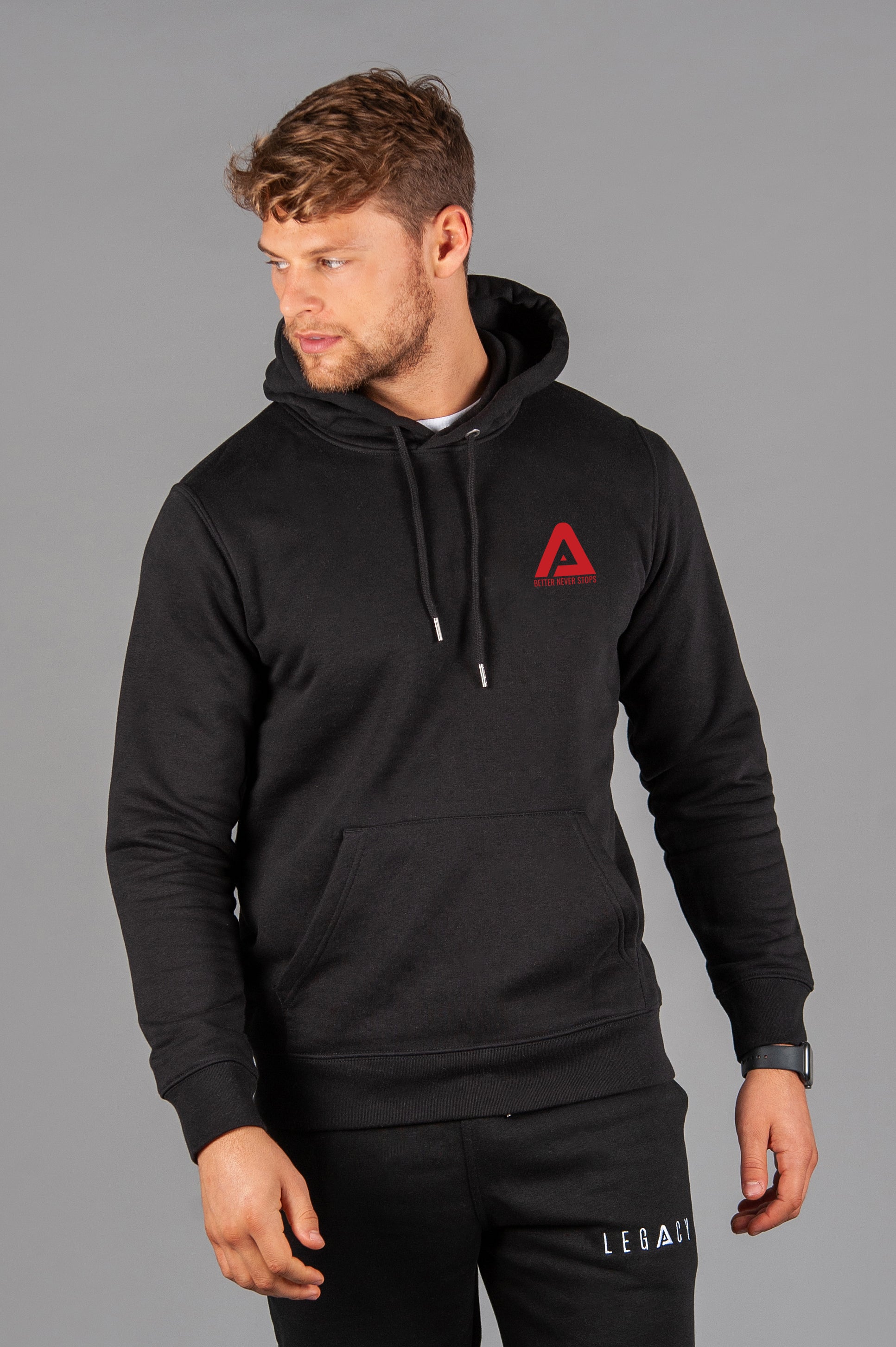 Men's black hoodie with small red Better Never Stops logo.