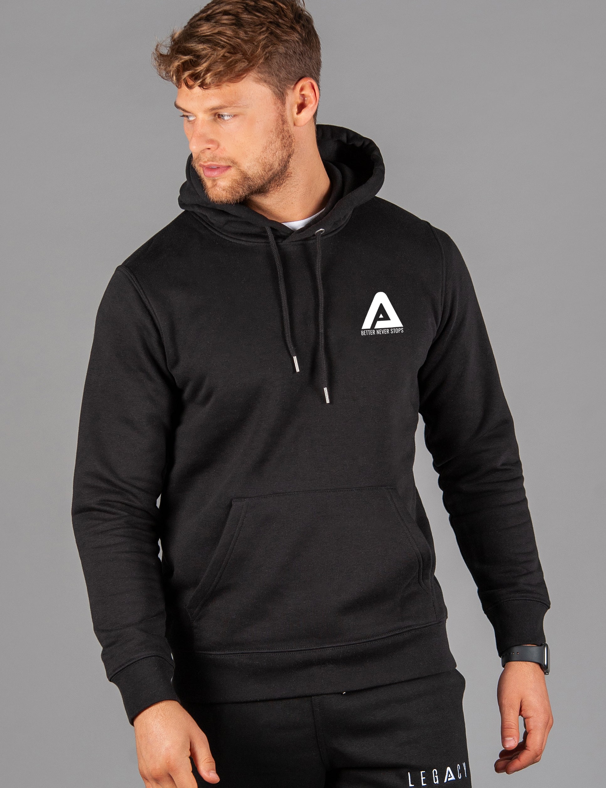 Men's black hoodie with small white Better Never Stops logo. 