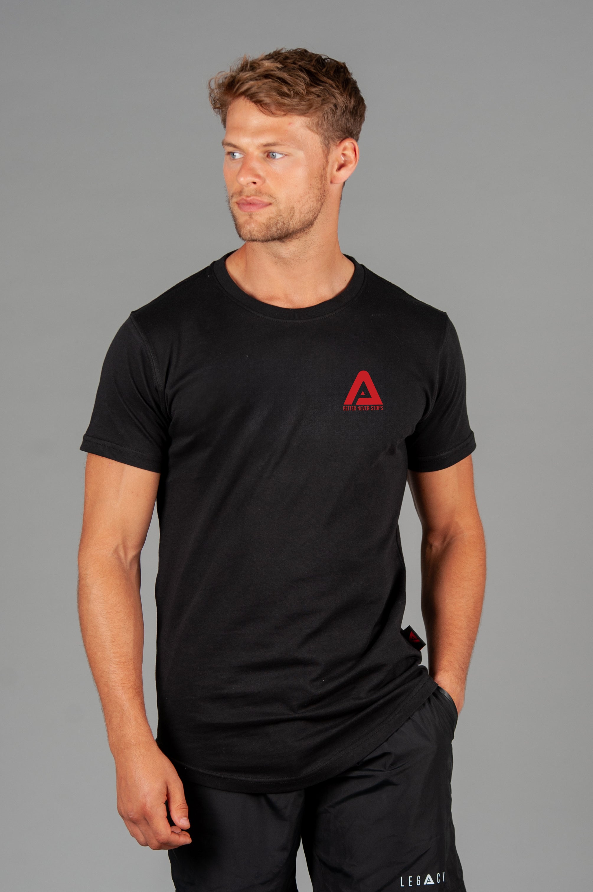 Men's black t-shirt with small red Better Never Stops logo.