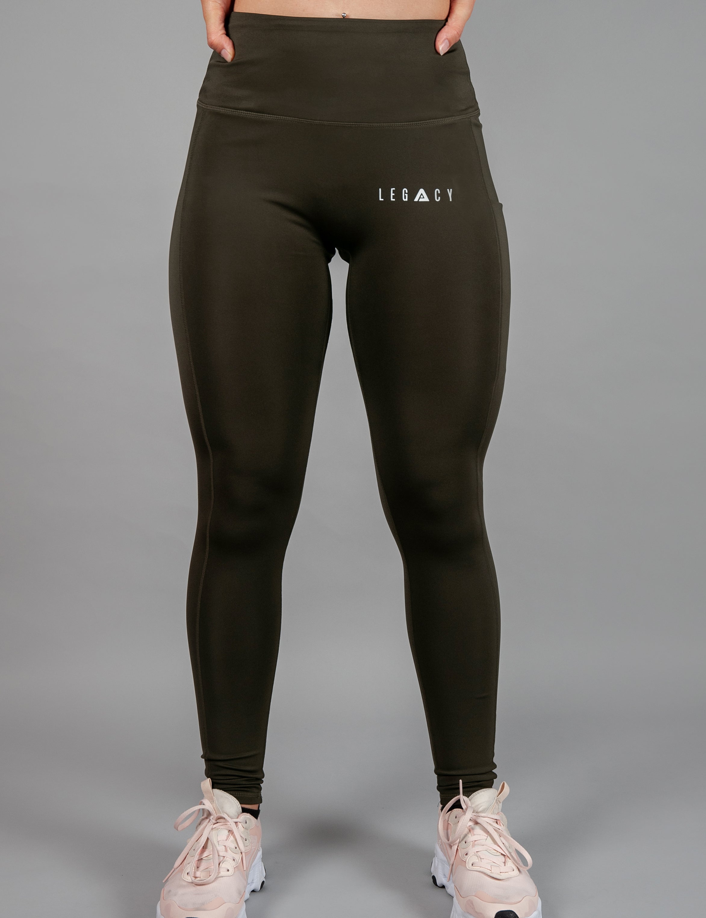 Women's olive full length workout leggings with small white hip logo.