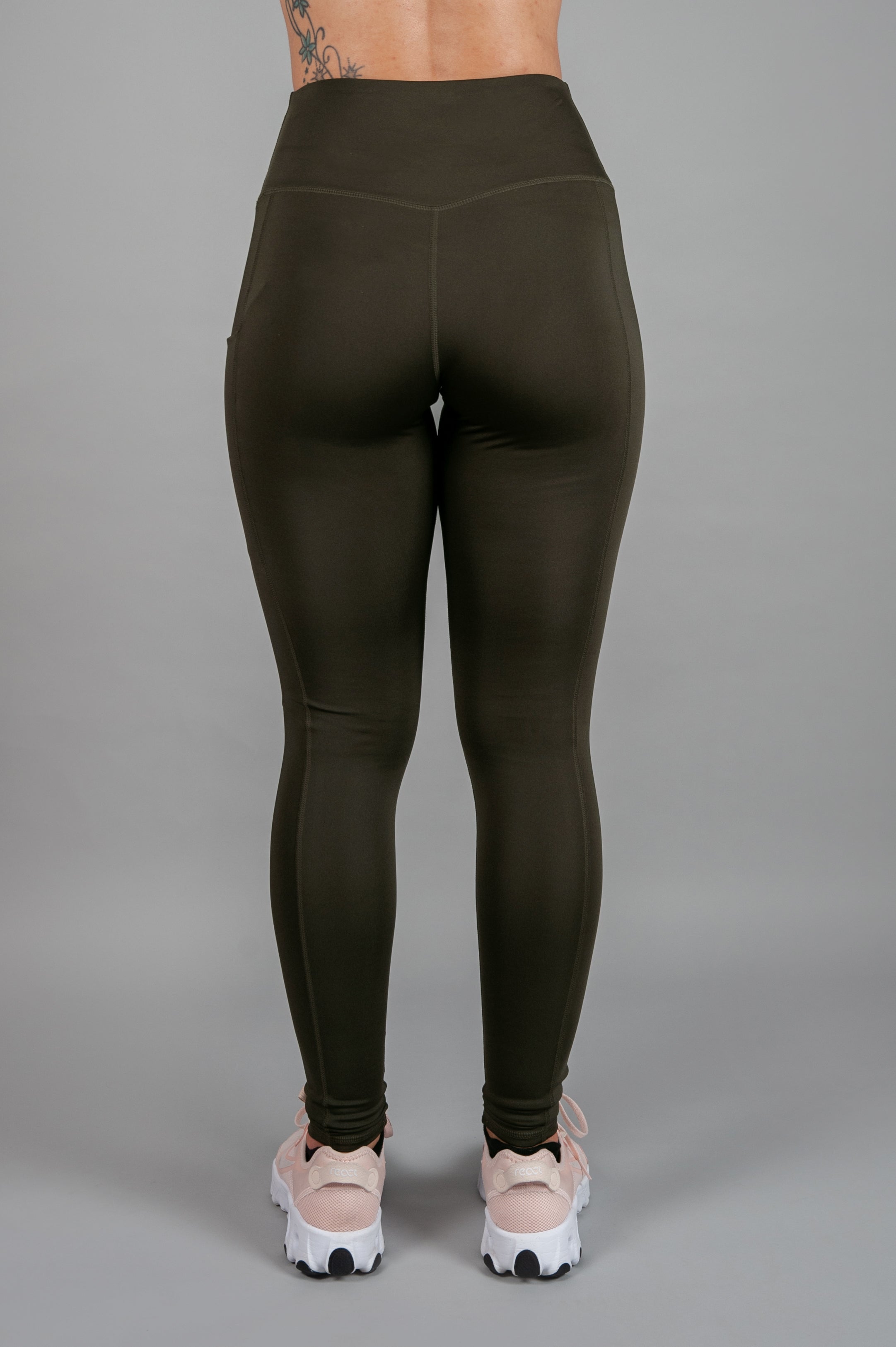 Back view of women's olive full length workout leggings.