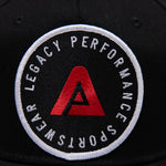 Black Legacy baseball cap with white and red logo. 