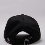 Snapback closure on black Legacy baseball cap with white and red logo. 