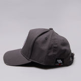 Side view of grey Legacy baseball cap with white, red and black logo.