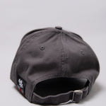 Snapback closure on grey Legacy baseball cap with white, red and black logo.