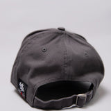 Snapback closure on grey Legacy baseball cap with white, red and black logo.