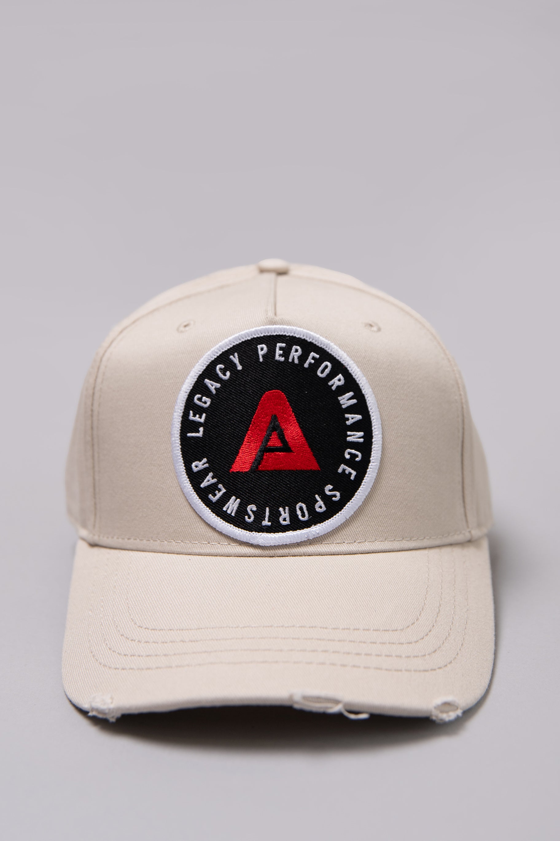 Stone Legacy baseball cap with black, white and red logo.