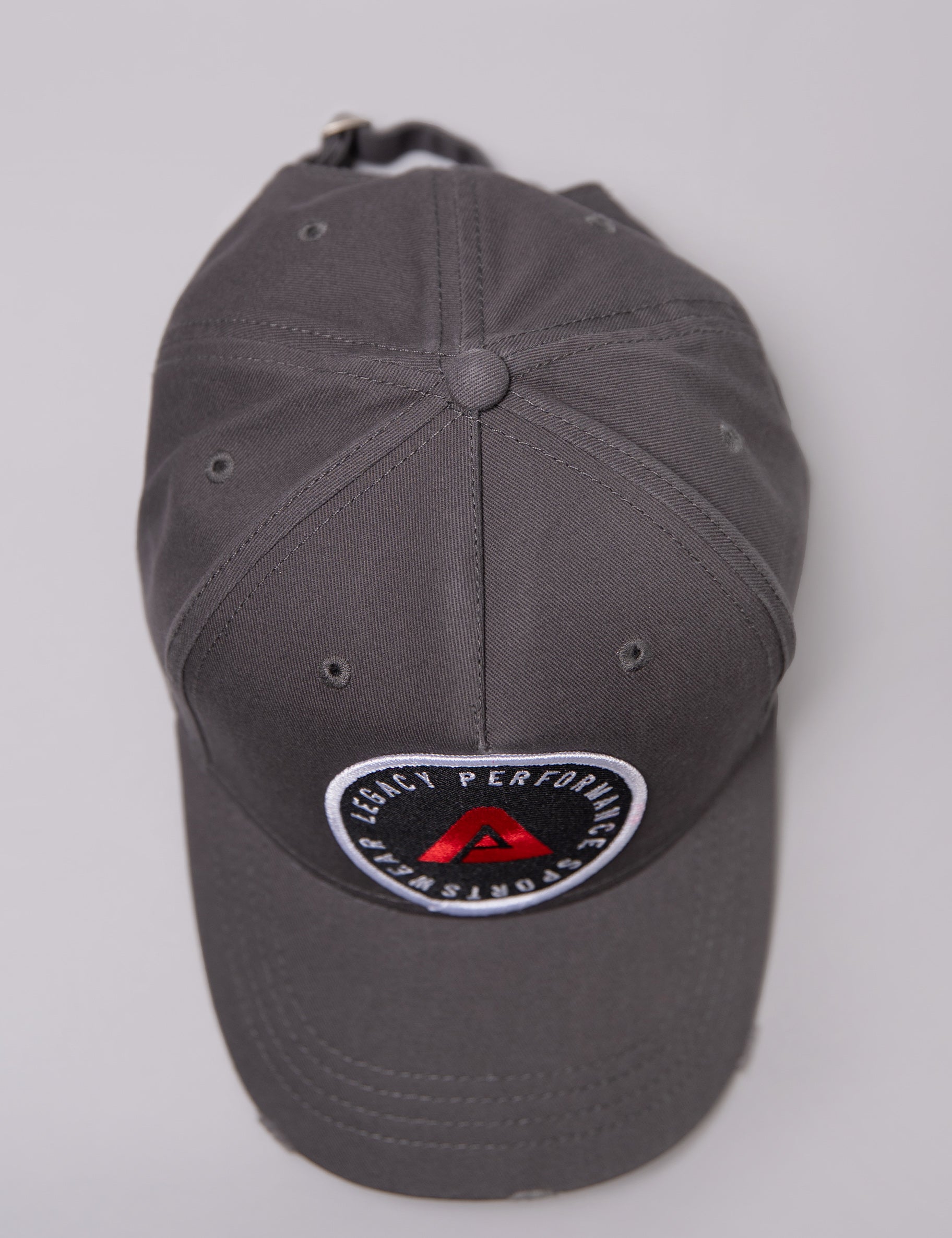 Grey Legacy baseball cap with white, red and black logo.