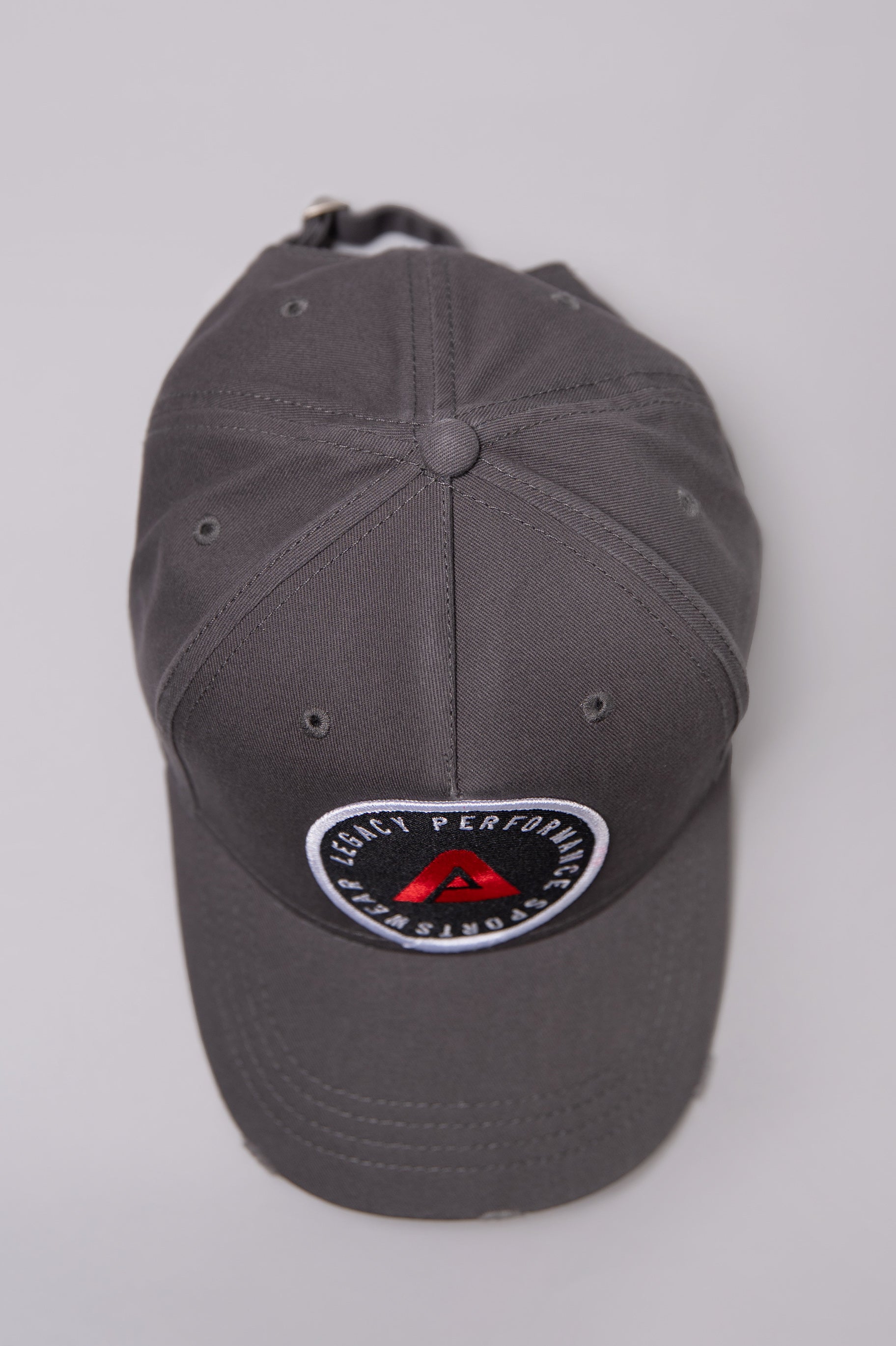 Grey Legacy baseball cap with white, red and black logo.