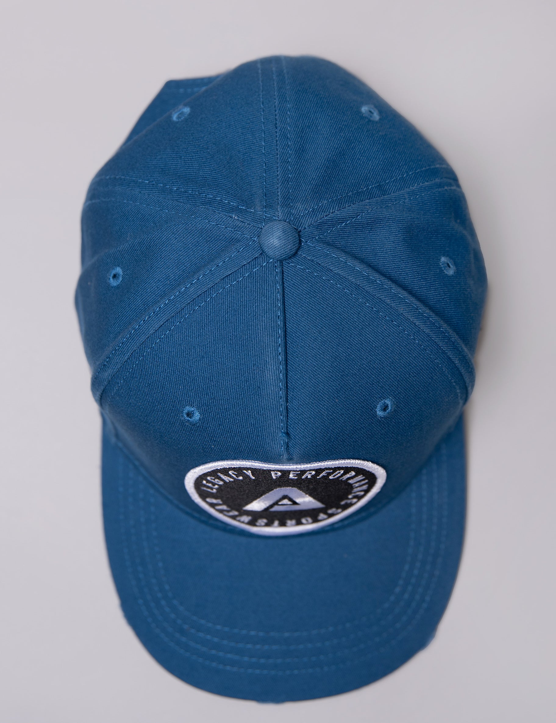 Navy Legacy baseball cap with black and white logo.