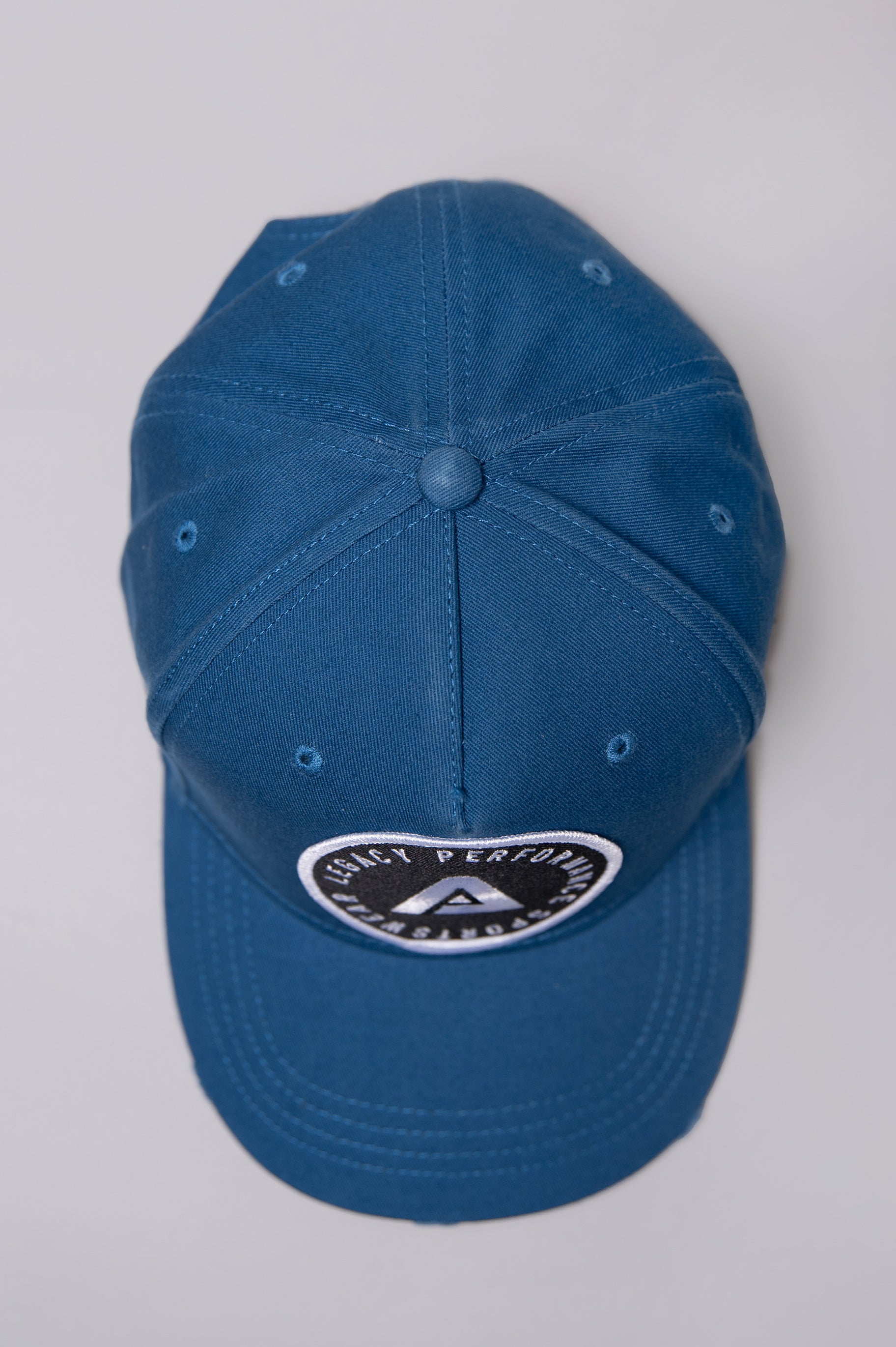 Navy Legacy baseball cap with black and white logo.