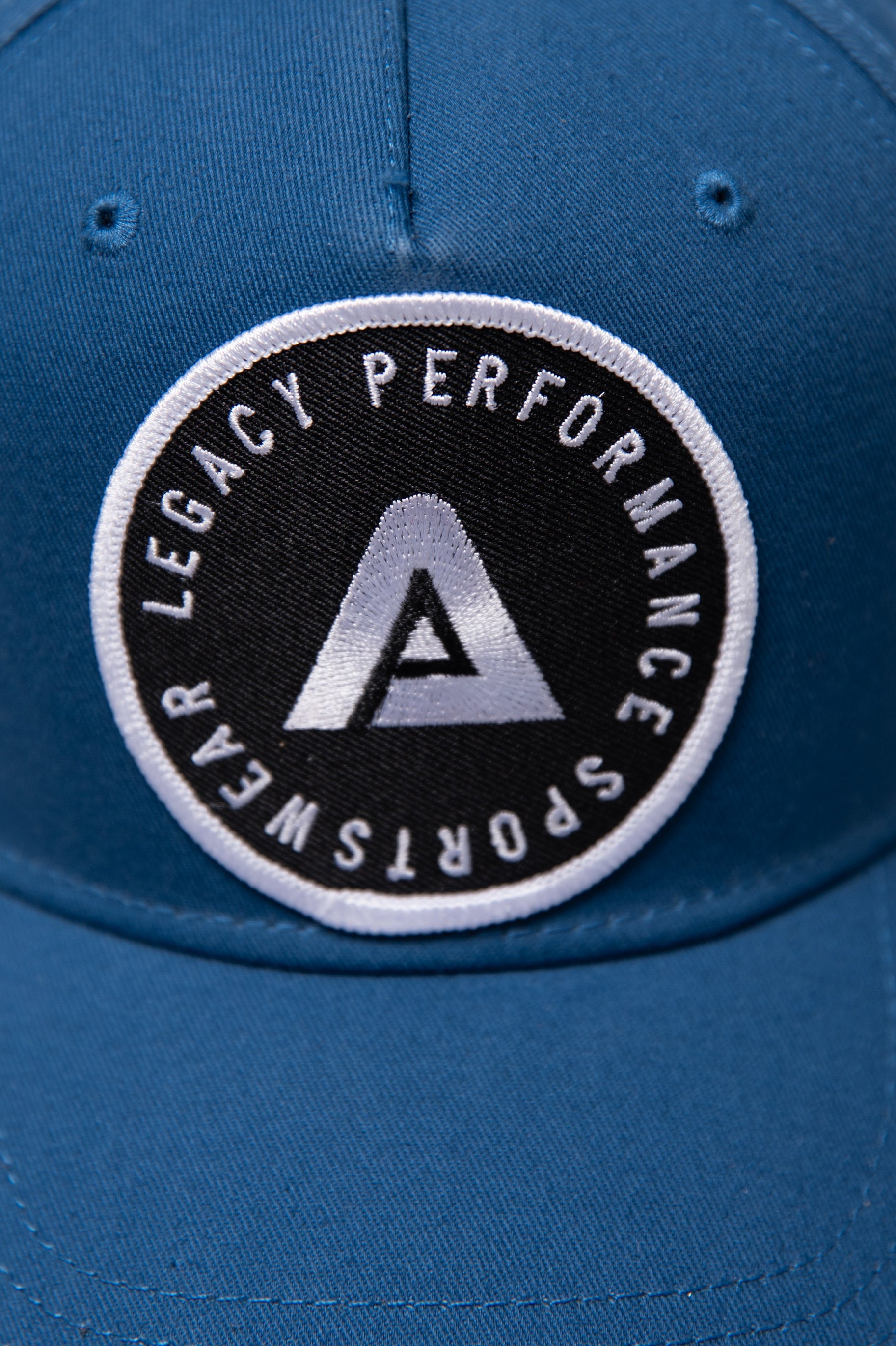 Navy Legacy baseball cap with black and white logo.