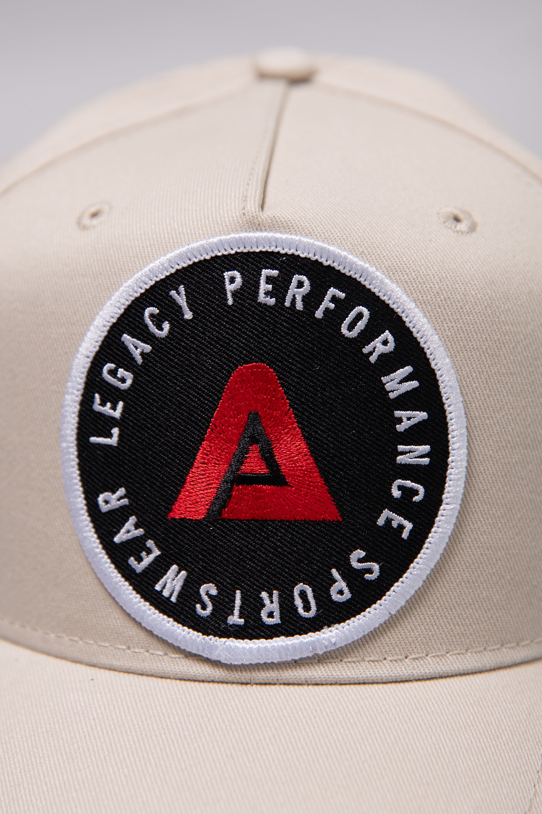 Stone Legacy baseball cap with black, white and red logo.