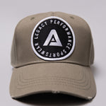 Khaki Legacy baseball cap with black and white logo.