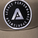 Khaki Legacy baseball cap with black and white logo.