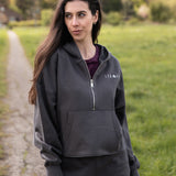 Women's graphite 1/4 zip cropped hoodie with small white logo.