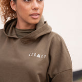 Women's olive oversized crop hoodie with tie waist and small white logo.