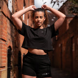 Women's black shorts with small white Legacy logo on leg.