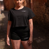 Women's black shorts with small white Legacy logo on leg.