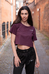 Women's burgundy crop t-shirt with white logo.