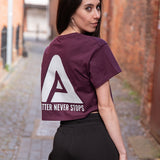 Back view of women's burgundy crop t-shirt with white Better Never Stops logo.