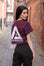 Back view of women's burgundy crop t-shirt with white Better Never Stops logo.