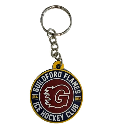 A circular rubber keychain featuring the Guildford Flames ice hockey club logo, attached to a silver metal split ring on a light gray background.