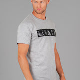 Men's grey t-shirt with black boxed Legacy logo across chest. 