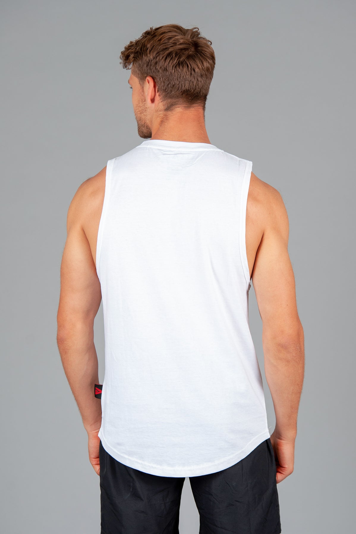 Back view of men's white tank.