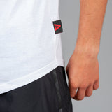 Close up of Legacy tag on men's white tank.