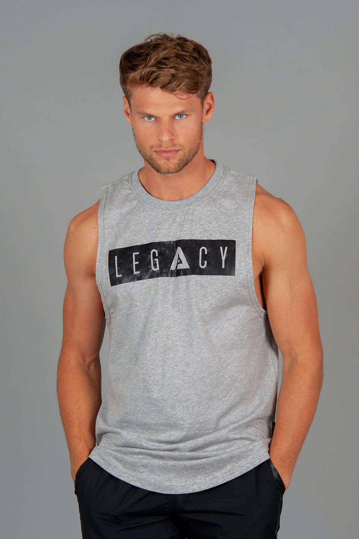 Men's grey tank with black boxed Legacy logo across chest. 
