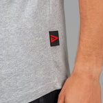 Close up of Legacy tag on men's grey tank.