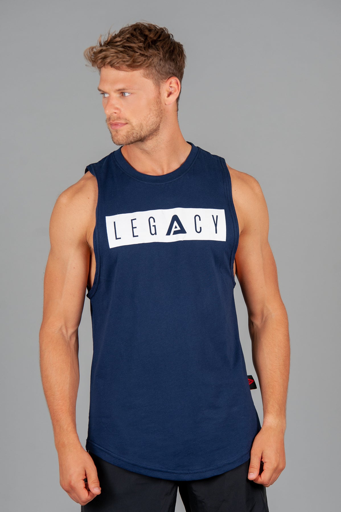 Men's navy tank with white boxed Legacy logo across chest. 