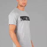 Men's grey t-shirt with black boxed Legacy logo across chest. 