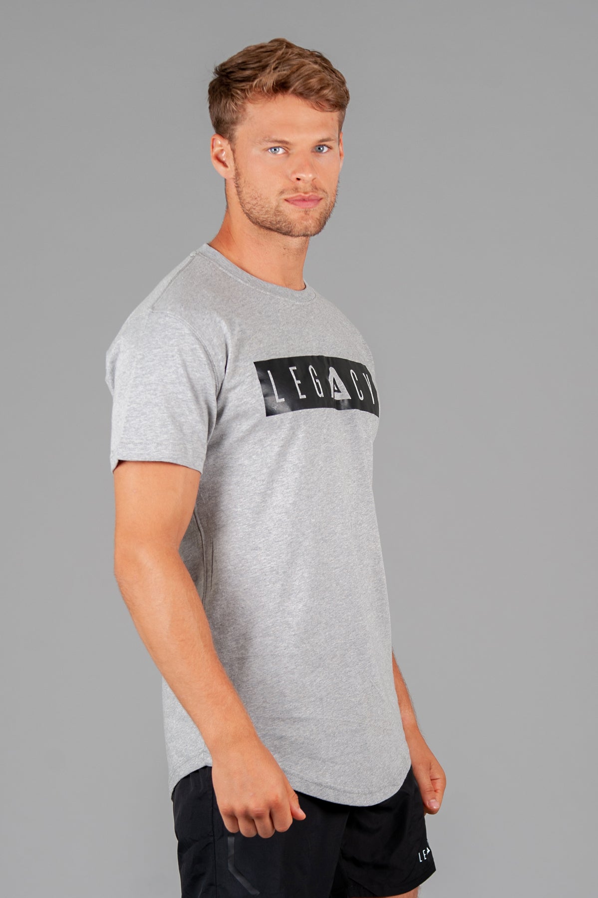 Men's grey t-shirt with black boxed Legacy logo across chest. 