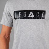 Men's grey t-shirt with black boxed Legacy logo across chest. 
