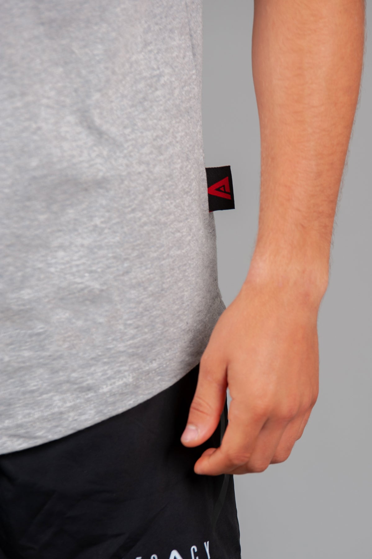 Close up of tag on men's grey t-shirt.